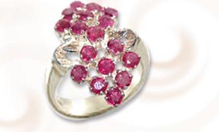Stunning Sterling Silver Ring garnished with the majestic Rubies.