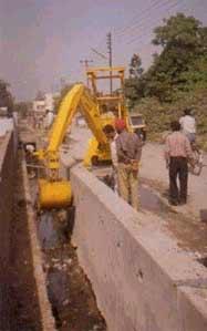 SKID STEER DRAIN CLEANING