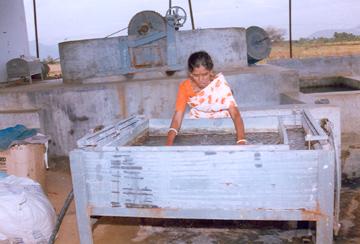 women mixing paper pulp