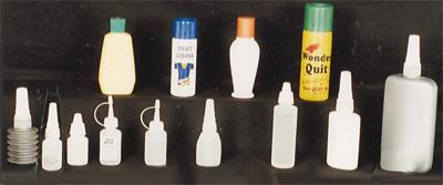 POURERS FITTED ON PLASTIC CONTAINERS