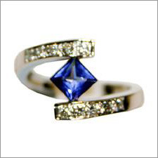Princess cut tanzanite ring in white gold with diamonds