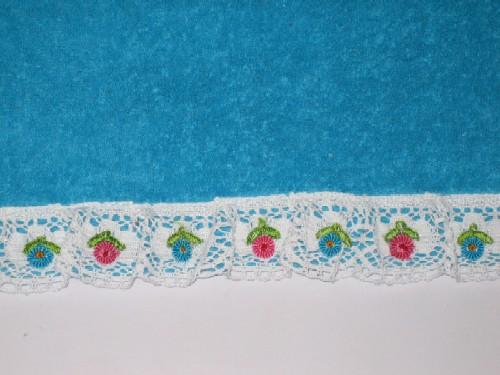 A towel with crochet lace.