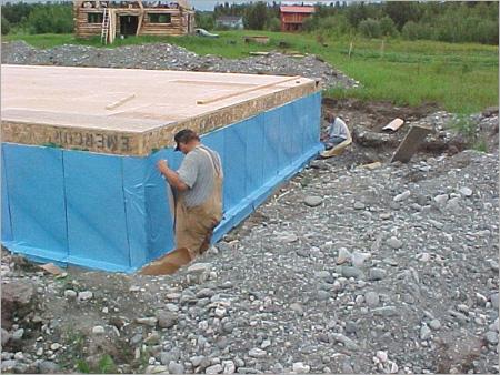 Waterproofing- 2-guys attaching waterproof