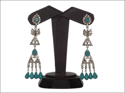 Earrings in metal White Rhodium Plated Studded with Firoza and Cubic Zirconia