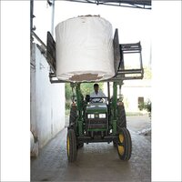 Paper reel handling with bale grabber attachment