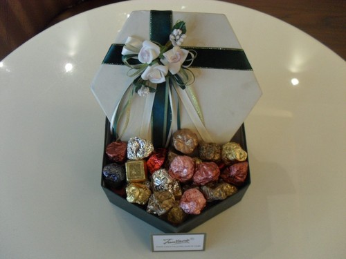 750gm Rich creamy milk dark assorted chocolates with nuts gift packed in white rose box.