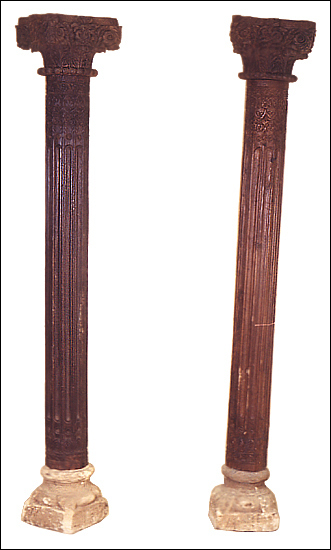 Teak Pair Of Ethnic Pillars On Stone Bases