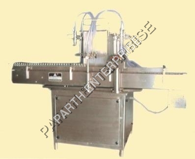 AUTOMATIC FOUR HEAD LIQUID FILLING MACHINE