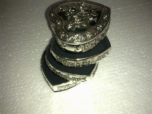white metal heart shaped 4 section box