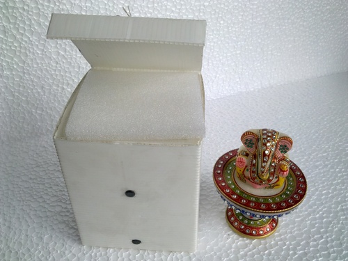 marble revolving ganesh ji with plastic packing box