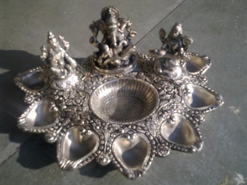 white metal ganesh,laxmi,saraswati with 7 deepak