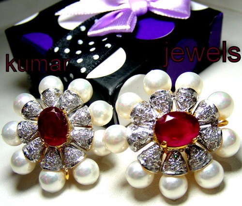 Designer earrings in diamond style with ruby or pearl ,royal look