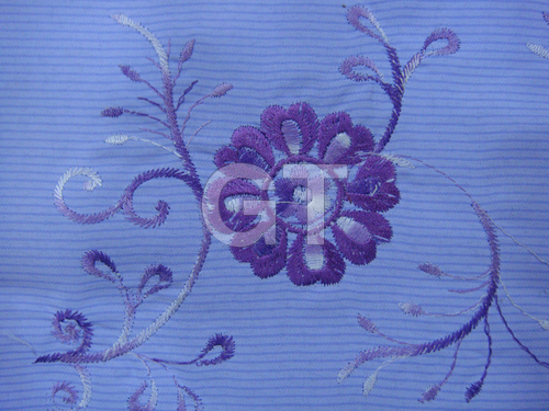 Embroidery on printed fabric
