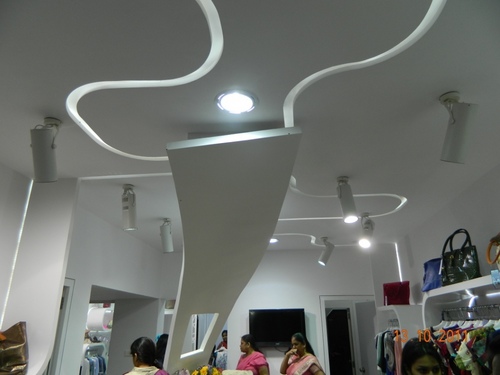 Retail Interior Designing - Custom Wood & Paint Finishes, LED Lighting, Space Planning, Client Collaboration, Budget Management
