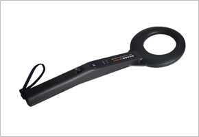 HAND HOLDS METAL DETECTOR
