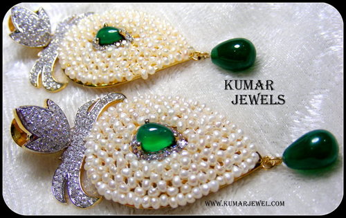  White Pearl Earrings. 
