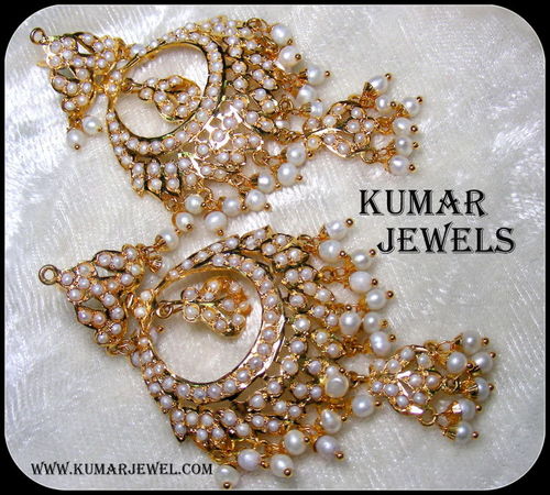 golden jadau pearl earrings.