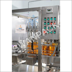 Bottle Filling Machine - Stainless Steel, 100-10000 ml Capacity | PLC Controlled, Clean Filling, Low Maintenance, Volumetric Pneumatic-Piston Technology