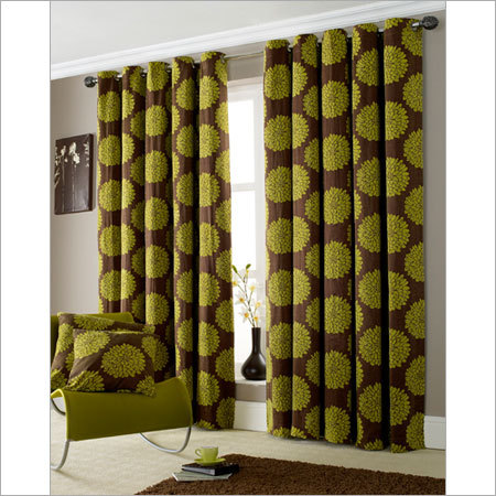 Green Curtains And Armchair In Living Room