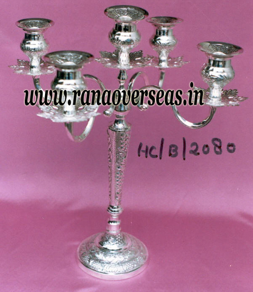 Polishing Brass Embossed Candle Holders In Silver Antique Finish.