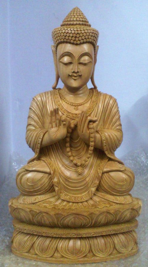 Wooden sitting kamal budha in sitting