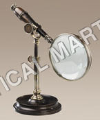 NAUTICAL MAGNIFYING GLASS WITH BRONZED STAND.
