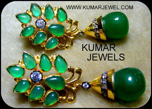 Green earring.