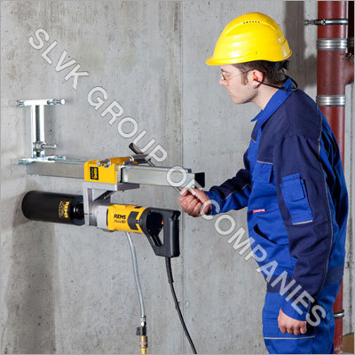 Diamond core drill machine working on RCC beam