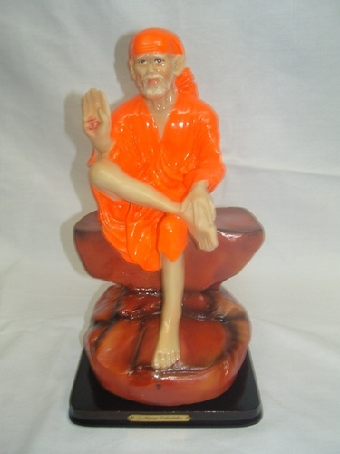 God - Sai Baba Polyresin Statue, 10 Inches Orange with Black Plastic Base, Detailed Carving, Glossy Finish, Spiritual Gift