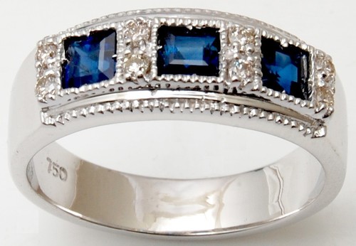 three stone ring with princess cut sapphire and brilliant cut diamond