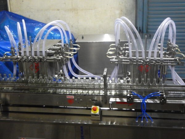 Twin Track Twelve Head Liquid Filling Machine