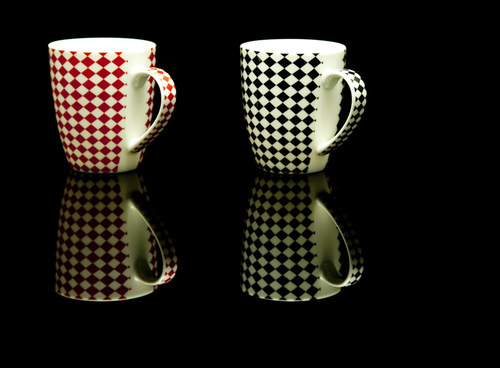 Checks Coffee Mug covered in a sleeve