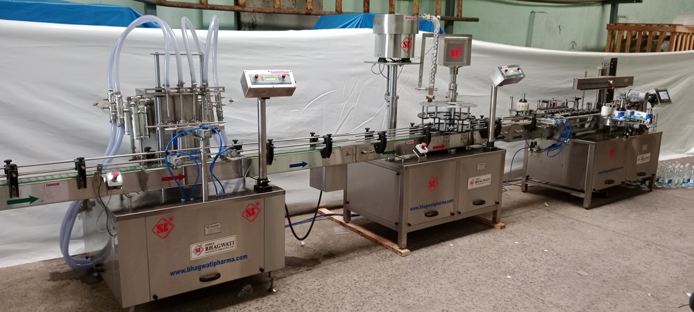 Automatic Volumetric Liquid Filling Machine - Stainless Steel, Adjustable Conveyor Height 860-910 mm | 1 HP Electric Drive, 1 Year Warranty, 4-8 Nozzles with PLC Control