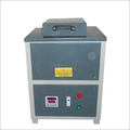 Induction melter with cooling system