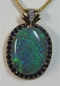 Opal Pendant - Gold, 20x15 Mm, Greenish-blue | Elegant Design, Fine Craftsmanship, Oval Shape, Bezel Setting With Sapphire Accents