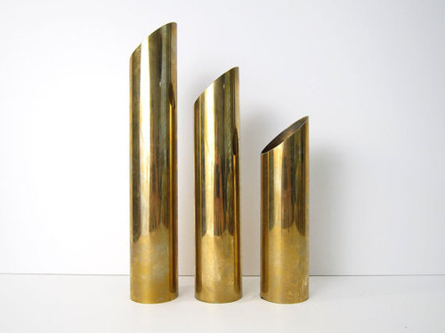 modernist brass candle holders