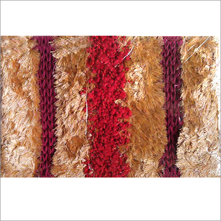 Door mat with carpet finish