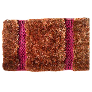 Door mat with carpet finish