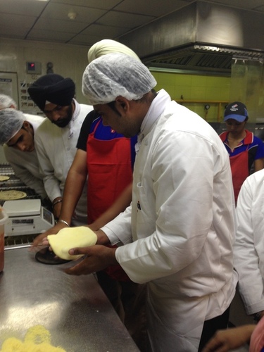 nfci students learning to prepare pizza