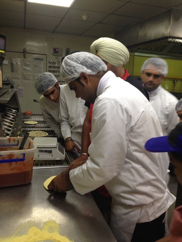 nfci students learning to prepare pizza