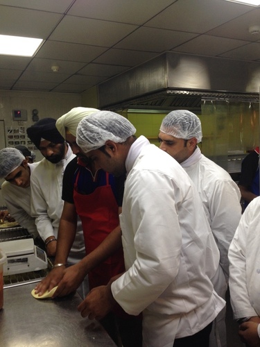 nfci students learning to prepare pizza