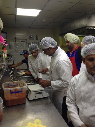 nfci students learning to prepare pizza