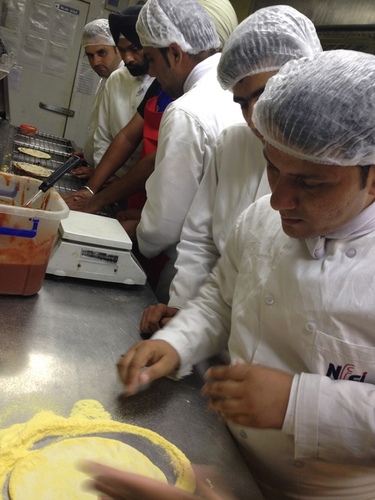 nfci students learning to prepare pizza