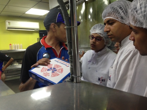 nfci students learning to prepare pizza