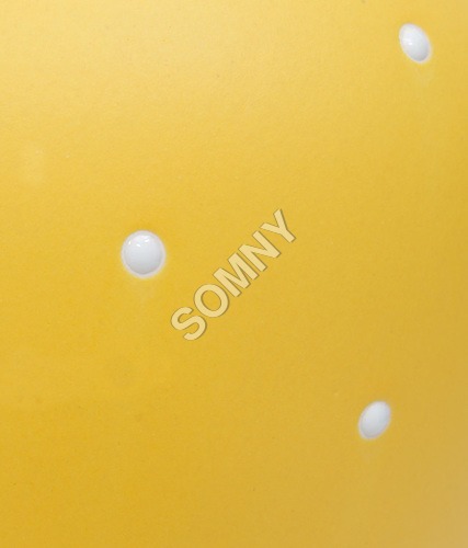 SURFACE PF POLKA DOTS ON YELLOW MAT