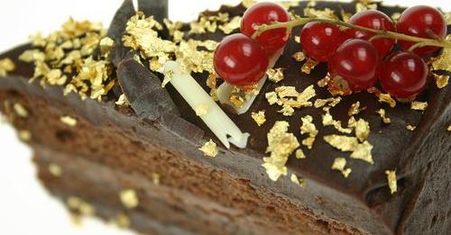 Gold flakes on chocolate fudge cake Gold flakes on chocolate fudge cake