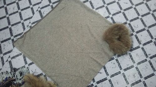 knitted pancho with raccoon fur coller