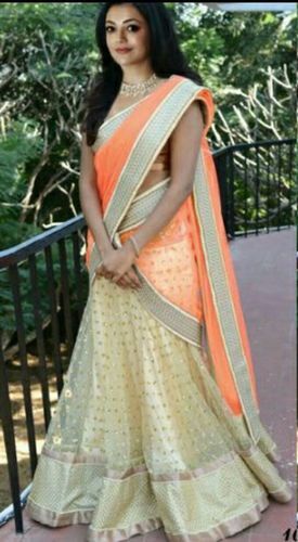 Cream And Orange Fashionable Designer Party Wear Lehenga