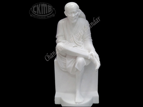 Polishing White Sai Baba Statue