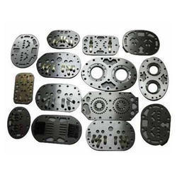 Valve Plates And Valve Assemblies